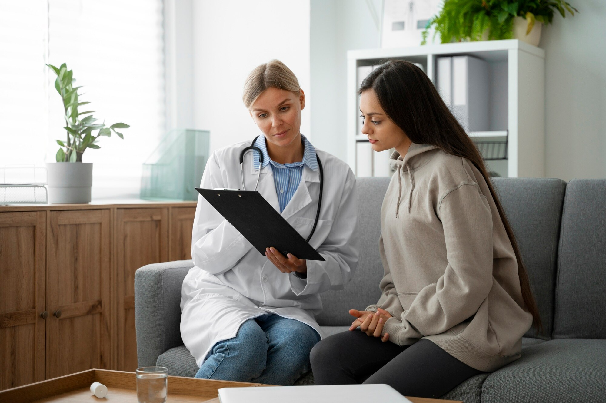 Female doctor meeting with a patient to review test results, findings or a health care concept.